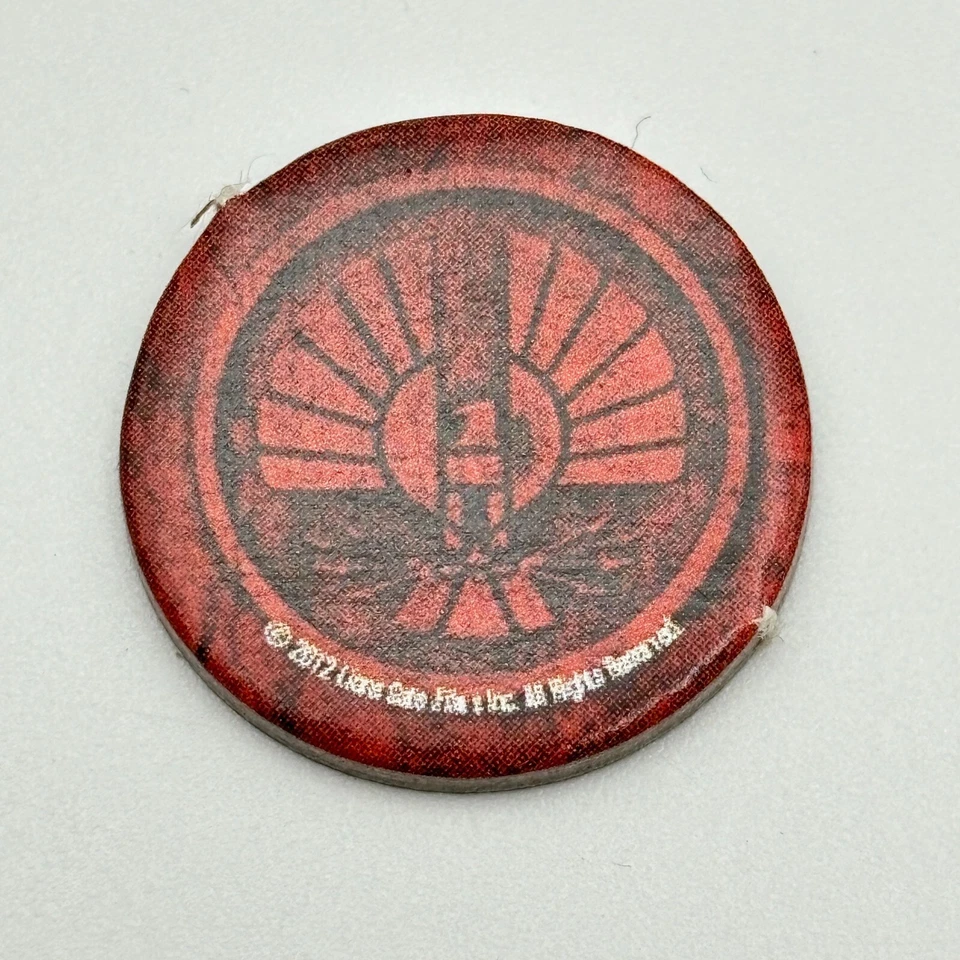 Ficha redonda The Hunger Games District 12 2012 piezas de repuesto piezas Foto 1 de 1