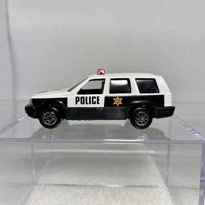 Yatming #827 Jeep Grand Cherokee Police 1/64 Diecast SUV Black & White - Image 1 of 4