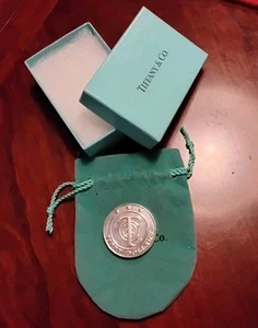 TIFFANY & CO $50 MERCHANDISE COIN. SILVER .925  RETIRED - Picture 1 of 5