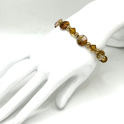 Brazalete elástico con cuentas de vidrio marrón, ámbar y dorado de 7,5" tonos tierra Foto 1 de 4