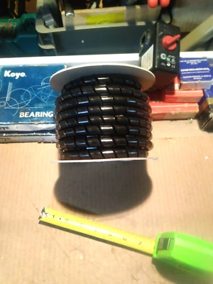 1/2" x 25'. Alpha Spiral Cut PE cable / hose wrap.  Same as Heli-Tube. **Cheap** - Image 1 of 4