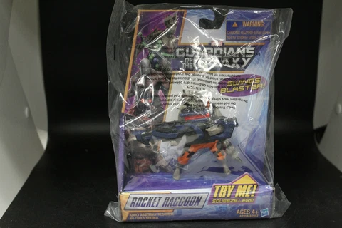 Guardians of the Galaxy Rocket Racoon 4"in Figure Squeeze Legs Swings Blaster! Cover