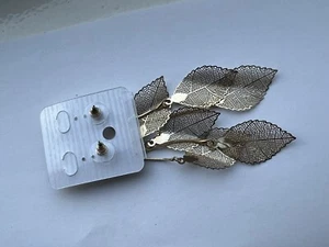 Orecchini pendenti grandi doppio cerchio placcati oro punk twist rombo foglia cava - Foto 1 di 4