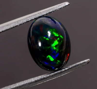 Piedra preciosa suelta cabujón forma ovalada ópalo etíope negro natural 2,5 quilates 11x8x6 mm Foto 1 de 3