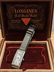 1940s Longines Platinum Case Diamond Dial Wristwatch. Platinum buckle.