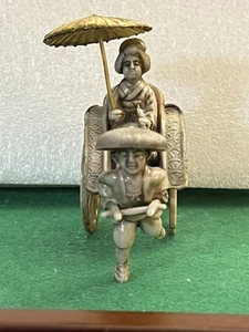 VINTAGE CELLULOID MAN PULLING GEISHA WITH UMBRELLA ON RICKSHAW CART JAPAN - Picture 1 of 19