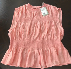 H & M Smocked Peplum Sleeveless Peach Color Top Blouse - SZ L New w Tag - Picture 1 of 5