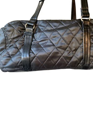 Black Quilted Duffel Bag With Shoulder Straps & Metal Buckle - Image 1 of 3