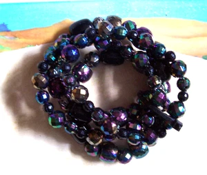 Juego de 4 pulseras elásticas negras de plástico y metal IRIDISCENTE - Imagen 1 de 3