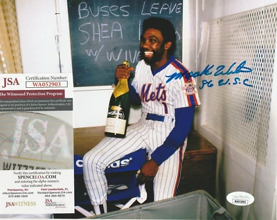 MOOKIE WILSON 8x10 SIGNED CELEBRATING METS 1986 WORLD SERIES CHAMPAGNE JSA COA - Image 1 of 4