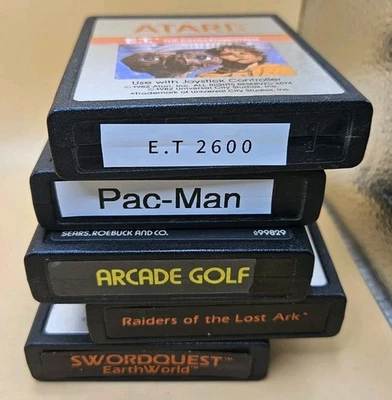Lot Of 5 Atari 2600 Cartridge Games Pac-Man E.T. Arcade Golf Raiders Swordquest - Image 1 of 3