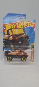 NEW Hot Wheels Mercedes-Benz Unimog 1300 Brown 2021 No 61 HKH26 Long Card Sealed - Picture 1 of 6
