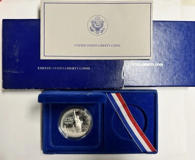 1986 S Ellis Islands Liberty Silver Dollar plus OGP w/ box, outer box, & sleeve - Image 1 of 4