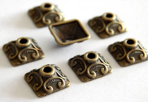 20 Perlenkappen 10mm bronze antik viereckig zB für Würfelperlen 10x4mm - Bild 1 von 3