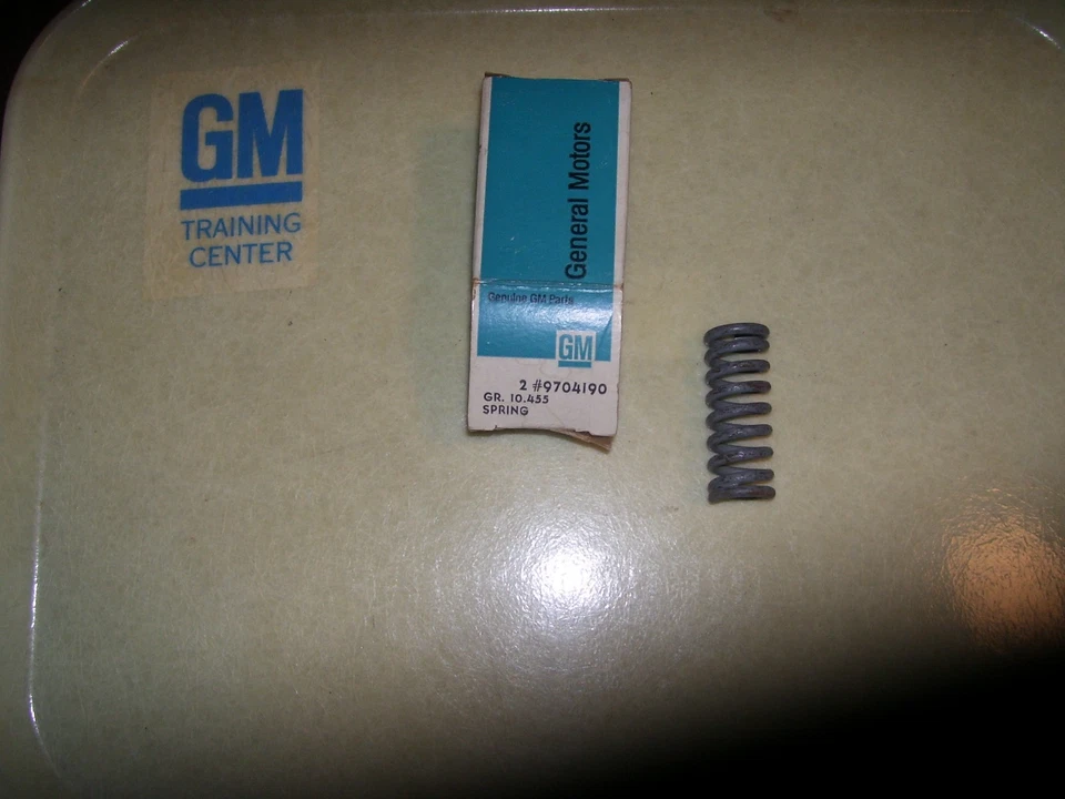 1965 – 1968 NOS Front Door Lower Hold Open Door Hinge Spring GM # 9704190 - Image 1 of 1