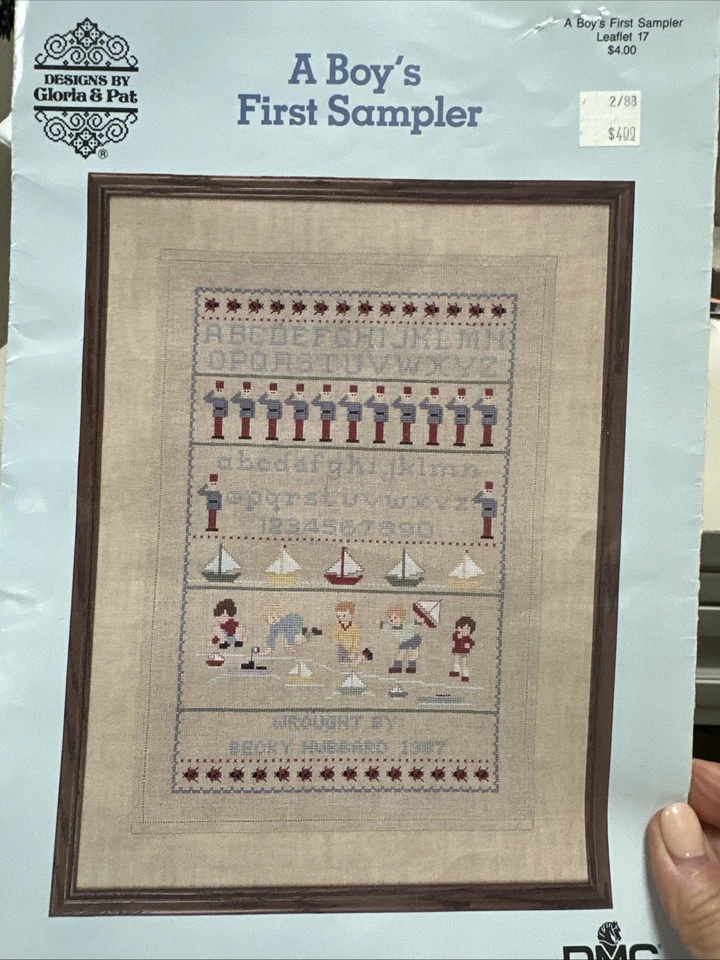 Libro de muestras de punto de cruz "El primer muestreador de un niño"  Foto 1 de 2