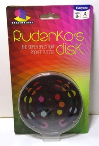 Brainwright Rudenko's Disk - The Super Spectrum Pocket Puzzle - Edades 8+ - Nuevo en paquete - Imagen 1 de 4