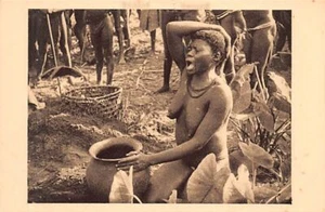 Central African Republic - Boubou woman in front of her husband's funeral urn - - Picture 1 of 2