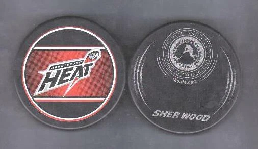 AHL RETRO ABBOTSFORD HEAT Souvenir PUCK DEFUNCT - #7L - Image 1 of 1