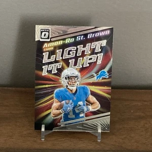 Amon-Ra St.Brown 2023-24 Panini Optic Football Light It Up - Bild 1 von 2