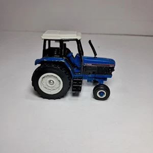 Vintage Ertl 1/64 Ford 7840 Tractor W/ Cab - Picture 1 of 7