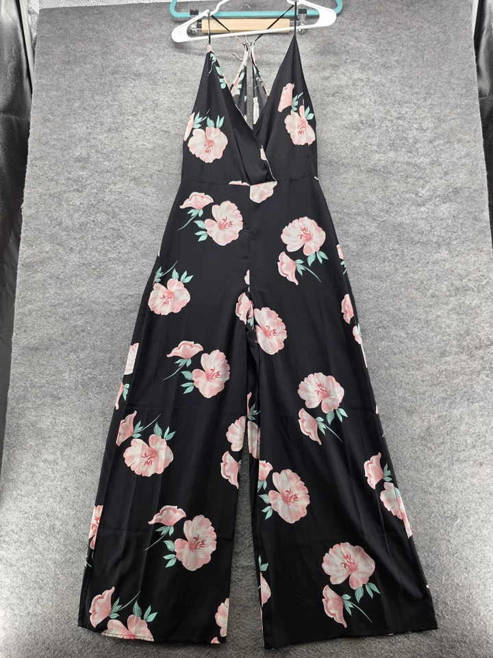 Mono exuberante para mujer mediano negro rosa floral pierna ancha tiras cuello en V lazo trasero Foto 1 de 4