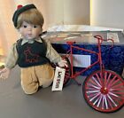 1993 Porcelain “Trevor” Doll With Red Bicycle By Dolls, Original Box And Owner
