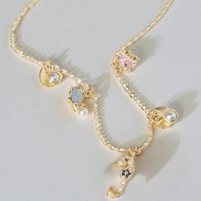 Gold Necklace with Seahorse and Shell Charms Ocean Inspired Jewellery Cute Gift - Image 1 of 4