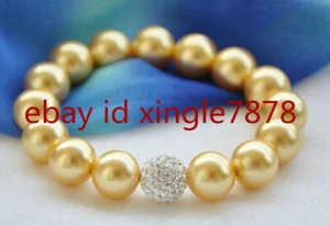 "Brazalete de cuentas redondas con cáscara de perlas dorada natural de 12 mm de moda 7,5""" - Imagen 1 de 4