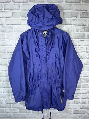 Chaqueta cortavientos con capucha azul/púrpura Helly Hansen para mujer S impermeable Foto 1 de 4