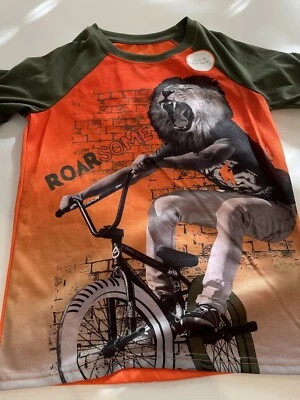 NWT Wonder Nation Boys Sleep Top Pajama Sz M Roarsome Lion On Bike Glow In Dark Foto 1 de 4