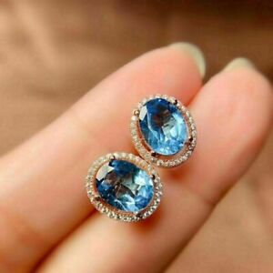 4Ct Oval Cut Blue Topaz Lab-Created Women's Stud Earrings 14K Yellow Gold Plated