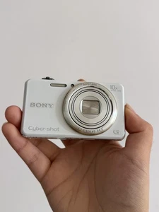 Sony WX100-25-250 mm Equiv, obiettivo Sony G, F/3.3-5.9, inglese, fotocamera digitale sottile - Foto 1 di 2