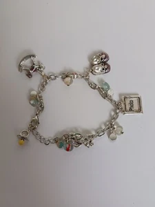 Avon Silver Toned Baby Charm Bracelet Pink Shoes Rocking Horse Teddy Bear & More - Picture 1 of 7