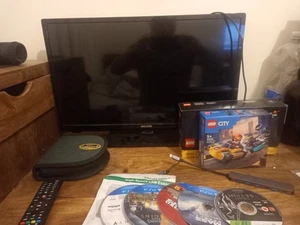 T.v. WALKER 24INCH LED TV AND A BUNCH OF OLD DVDS GAMES LEGOS AND WHATEVER ELSE - Picture 1 of 2
