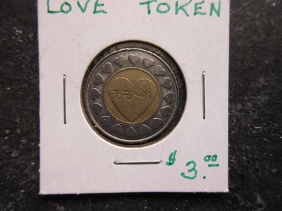 Ficha de amor de metal Foto 1 de 2