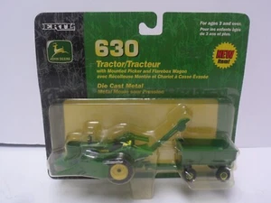 1/64 Ertl John Deere 630 Tractor w/Mounted Picker & wagon NIP - Picture 1 of 4