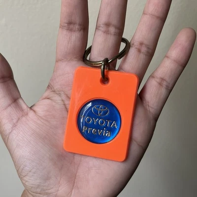 Vintage Toyota Previa Emblem Key Ring Orange Plastic 1990s Rare Car Memorabilia - Image 1 of 4