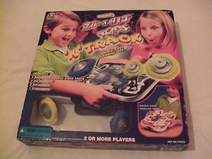 Toy TechTurbo con cremallera 'N' Hit Tops 'N' Track Inc 2 camisetas giratorias de doble cara - Imagen 1 de 4