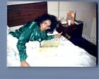 FOUND COLOR PHOTO I+9365 PRETTY BLACK WOMAN IN GLASSES IN BED WITH PHONE BOOK