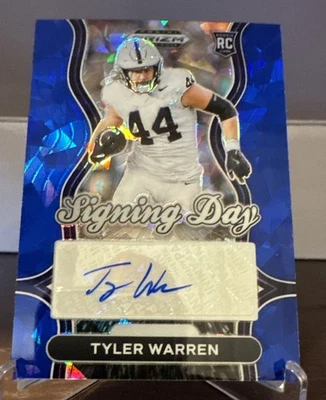 Prizm Draft Picks 2025 día de firma Tyler Warren radiocontrol azul hielo Prizm automático/45 Foto 1 de 2