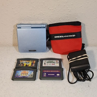 Consola Nintendo Game Boy Advance GBA SP AGS-101 azul perla con cargador y 4 juegos Foto 1 de 4