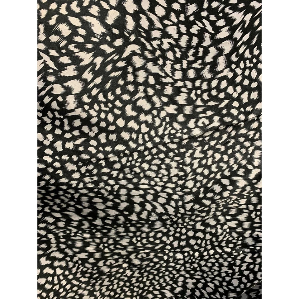 Manchas blancas sobre negras - Tela satinada Charmeuse de seda sintética Foto 1 de 1