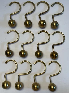Set 12 ganci per tenda da doccia a sfera tono oro. Modello unico. - Foto 1 di 6