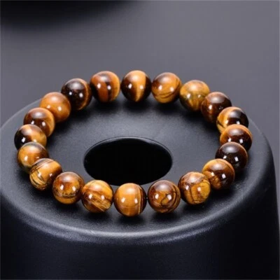 Brazalete elástico de piedras preciosas marrones con ojo de tigre natural de 8 mm hecho a mano Foto 1 de 2
