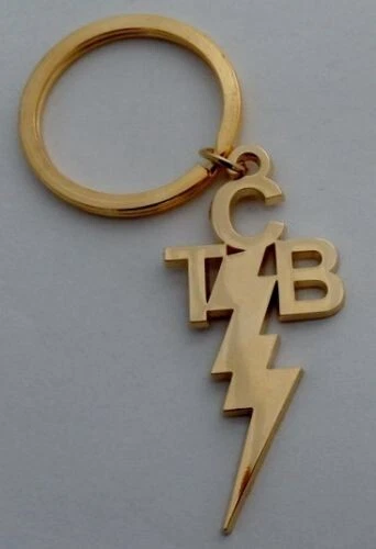 Pretty Green ' Taking Care of Business ' Gold / Gilt TCB KeyChain / KeyRing. - Image 1 of 1