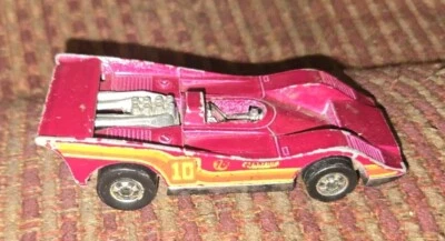 Coche de carreras Hot Wheels Mattel 1973 rojo magenta #10 American Victory Pennzoil 76 Foto 1 de 4