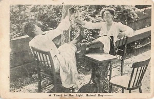 Vintage Postcard - 1908 / 1 cent stamp - COUPLE - B&W - sitting toasting - Picture 1 of 2