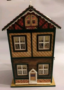Christmas Traditions Animated Musical House Lighted Wind-up & Battery Operated - Picture 1 of 16
