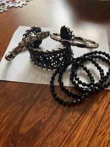 COLLECTION OF BLACK WRIST ENHANCEMENTS, BANGLES, BRACELETS, CUFF, JUICY - Picture 1 of 3